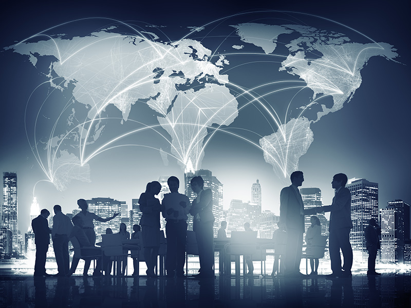 envisionglobal-blog_characteristics_of_a_global_leader_people_meeting_discussion_global_business_conceptbusiness_success_and_control_with_confident_boss_against_cityscape_0